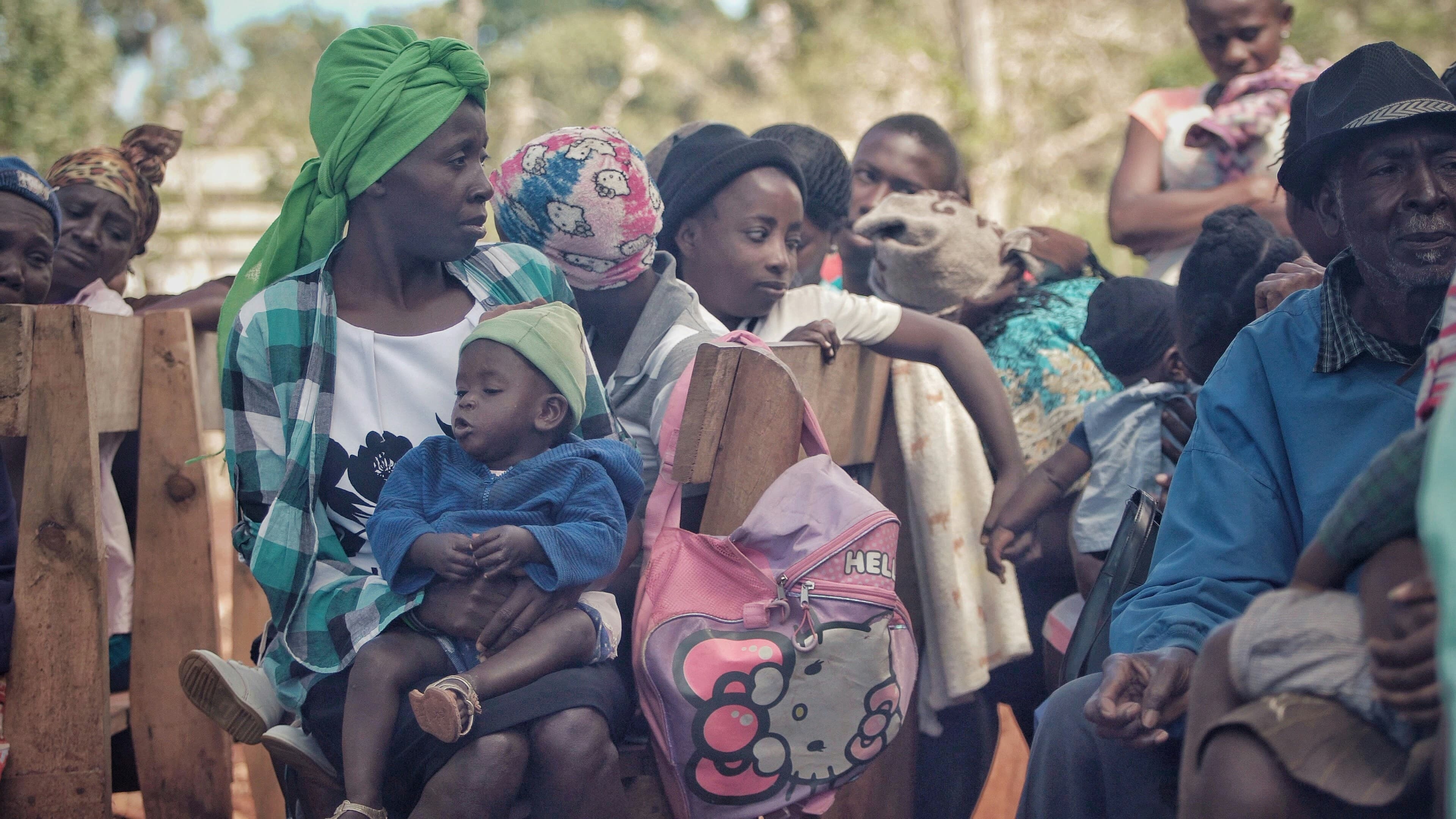 Women and children seated together at a community gathering